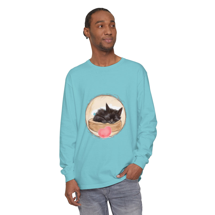 A cute grey and white kitten peacefully sleeping on a cozy bed, illustrated on a unisex t-shirt perfect for bedtime