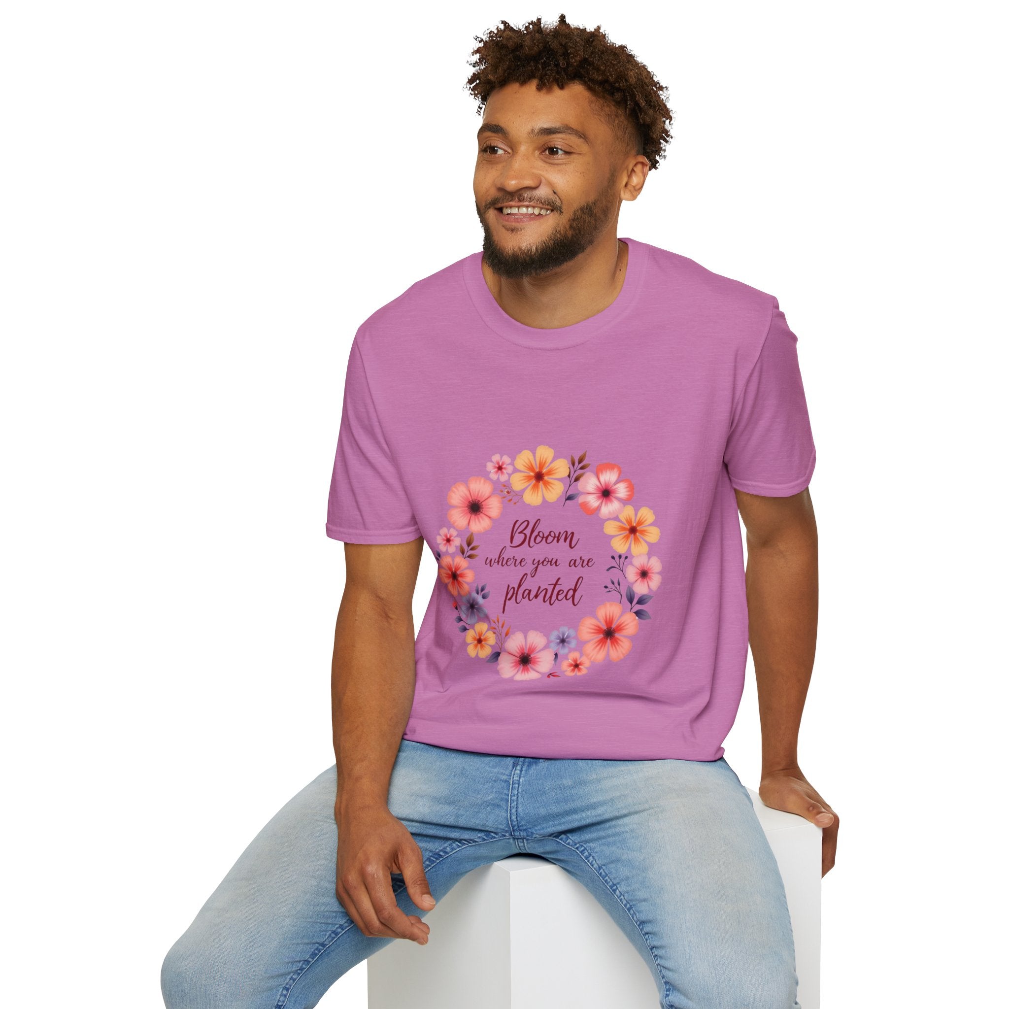 A close-up image of a white t-shirt with a beautiful floral mandala design and a quote, perfect for any casual outfit