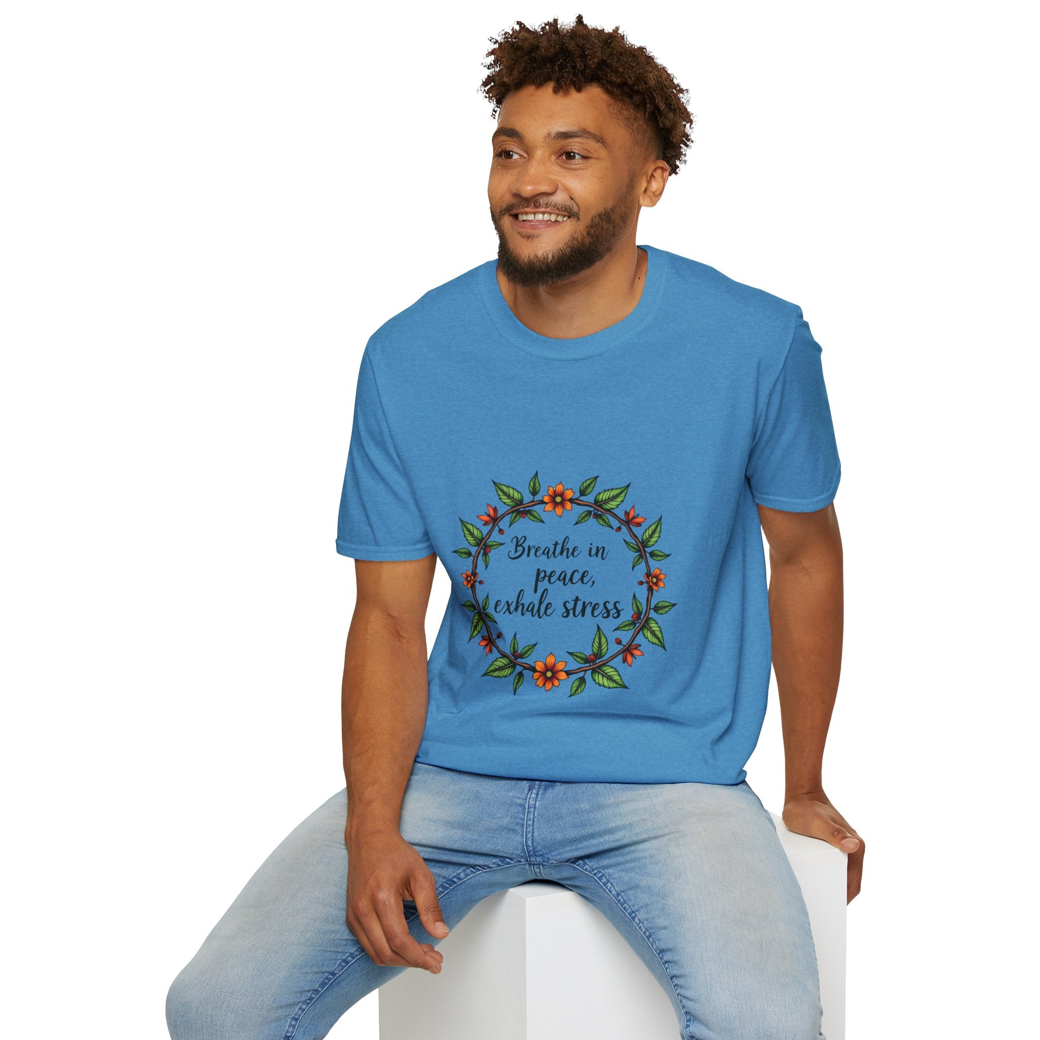 White t-shirt with floral garland design and the phrase 'Breathe in Peace Exhale Stress' printed in a stylish font