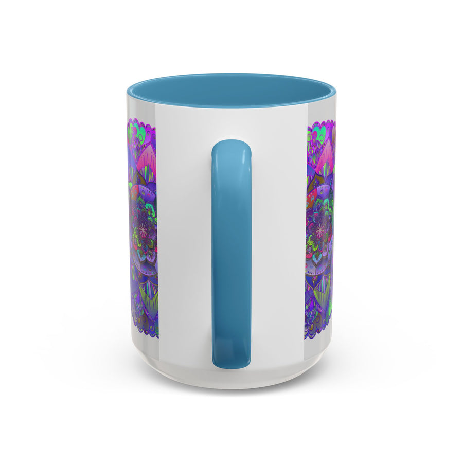 A light grey ceramic mug featuring an intricate mandala art design