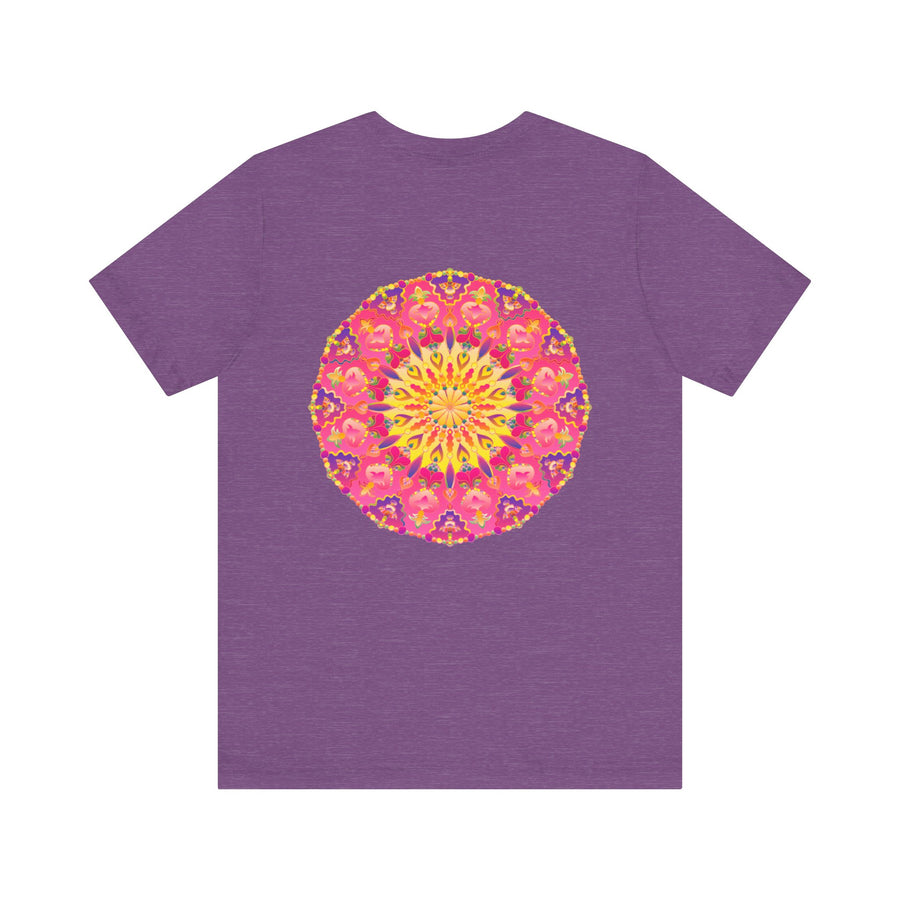 A vibrant and colorful pink and yellow mandala T-shirt featuring a design that represents peace and harmony