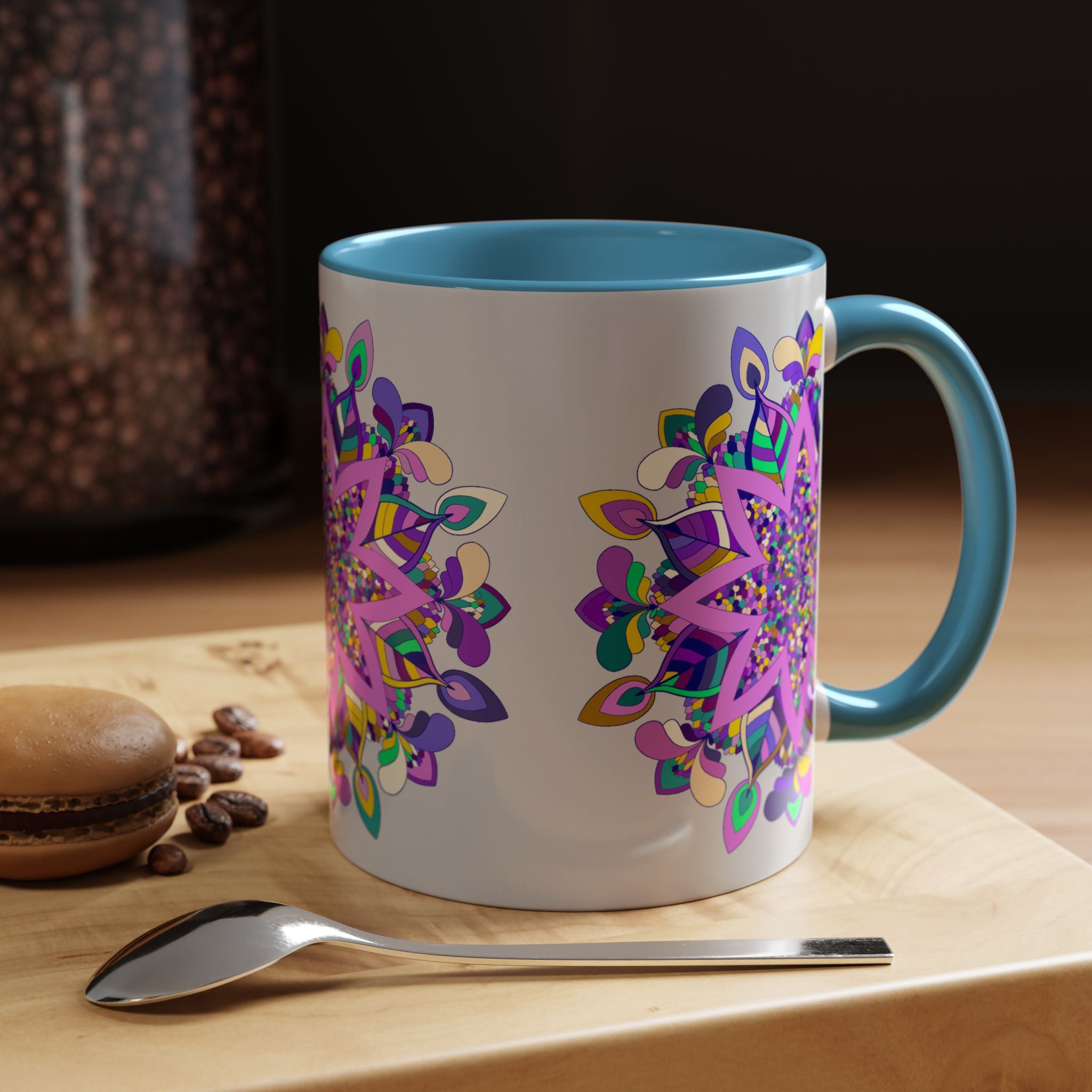 Handcrafted ceramic mug with beautiful mandala design in shades of blue, pink, and gold