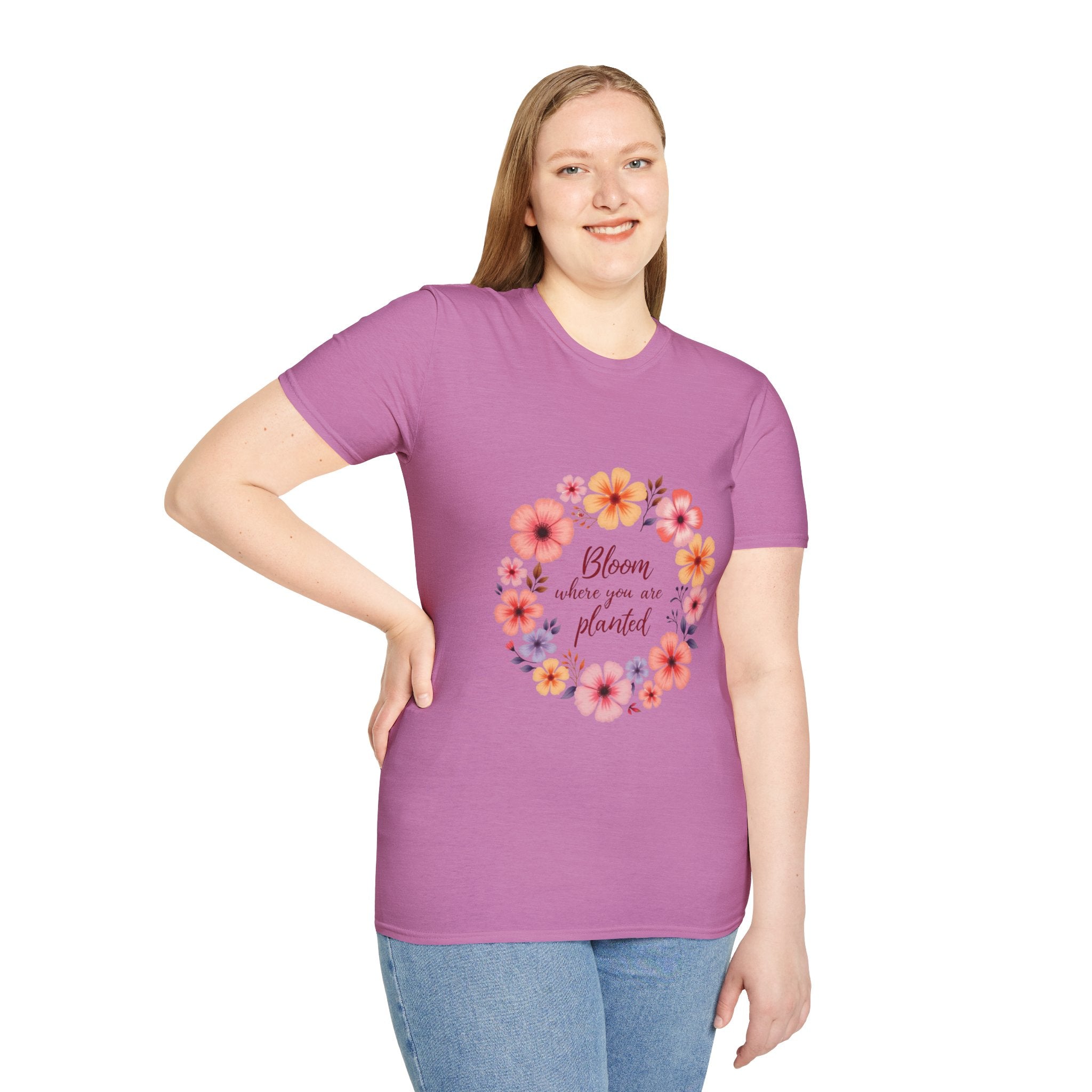 A close-up image of a white t-shirt with a colorful floral mandala and a quote printed on it