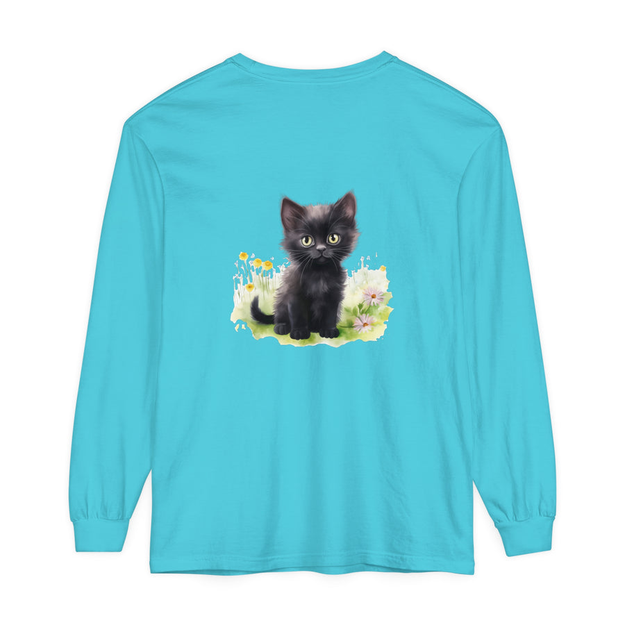 A black kitten sitting in a colorful flower garden, printed on a long sleeve t-shirt