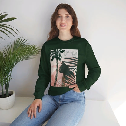 A cozy unisex heavy blend crewneck sweatshirt featuring a cat lounging under palm trees