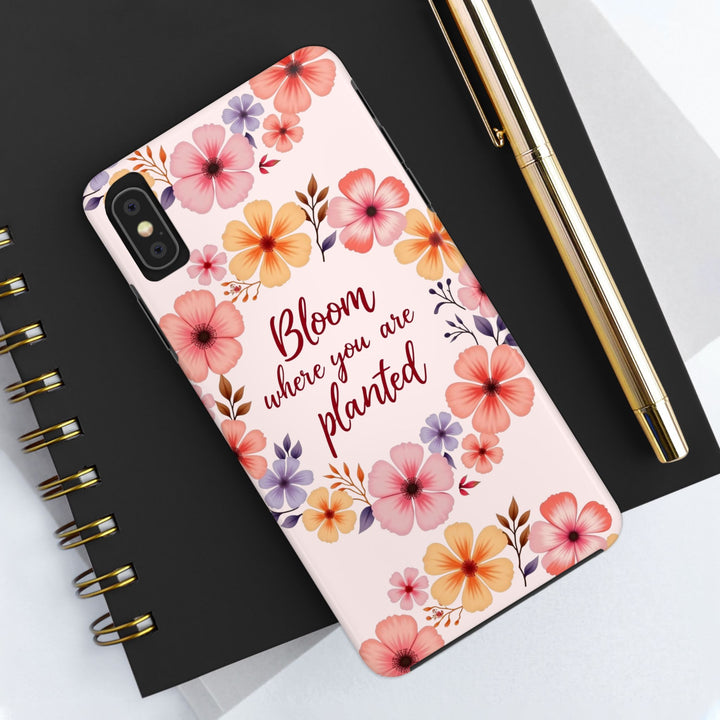 A light pink phone case with a beautiful flower garland bloom design