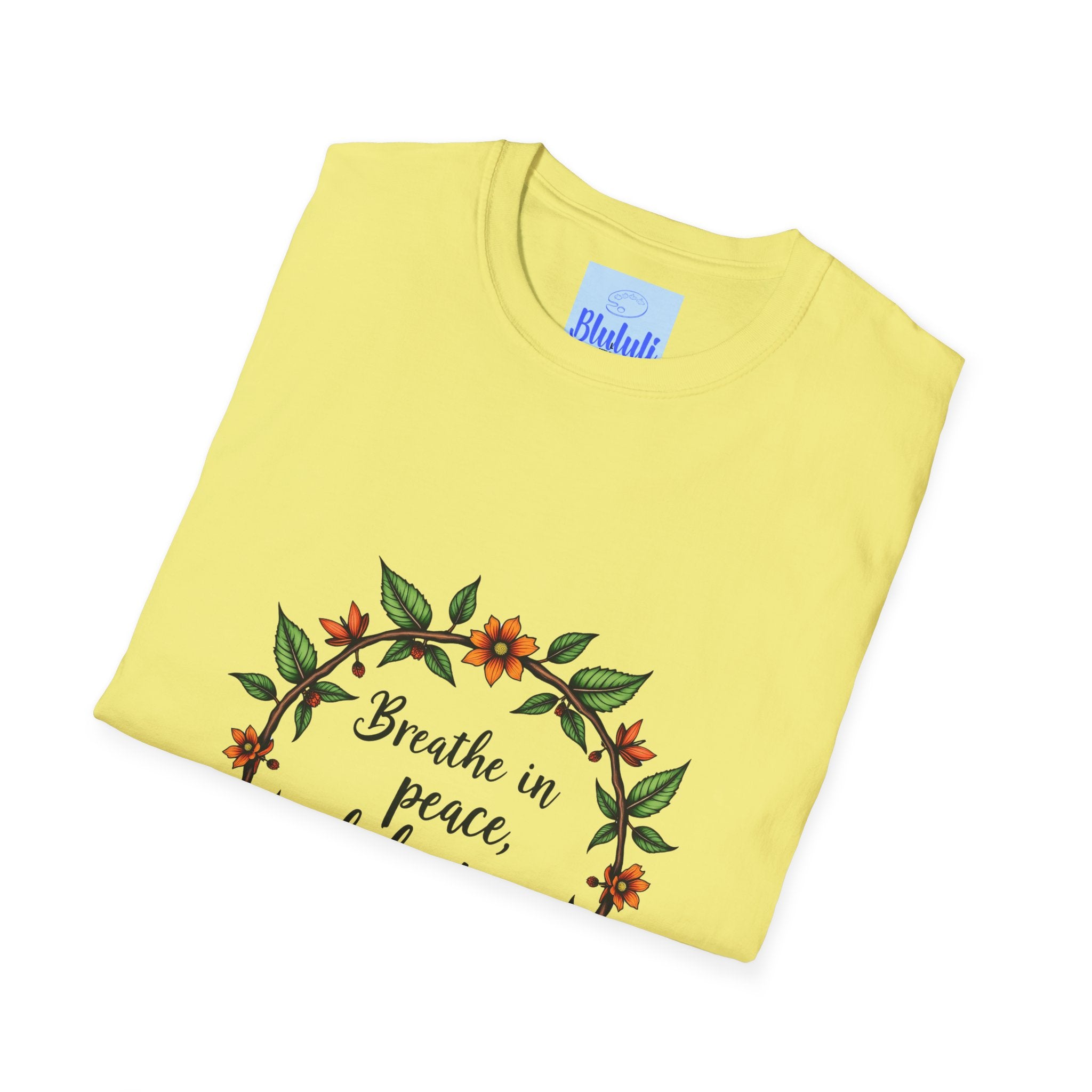 A stylish white t-shirt with a vibrant floral garland design that reads Breathe in Peace Exhale Stress