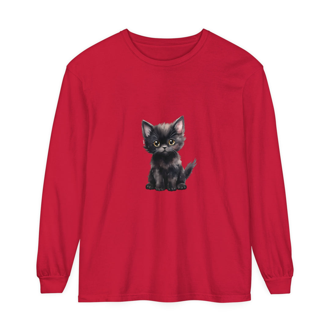 Adorable black kitten with striking yellow eyes on a comfortable long sleeve t-shirt