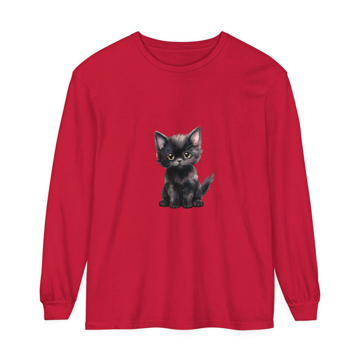 Adorable black kitten with striking yellow eyes on a comfortable long sleeve t-shirt