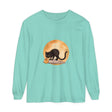 A spooky black cat sitting under a crescent moon on a Halloween-themed t-shirt