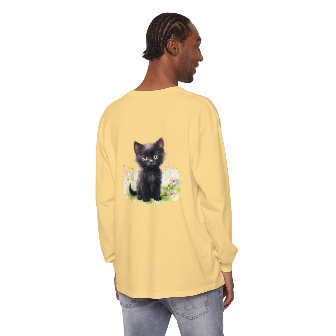 A long sleeve t-shirt featuring a black kitten surrounded by colorful flowers in a garden setting