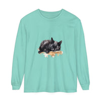 A comfortable black t-shirt featuring a watercolor design of a sleeping cat