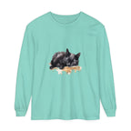 A comfortable black t-shirt featuring a watercolor design of a sleeping cat