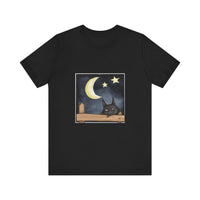 A black t-shirt with a sleepy cat design against a moonlit night background