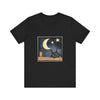 A black t-shirt with a sleepy cat design against a moonlit night background