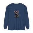 A cute black kitten with striking yellow eyes on a long sleeve t-shirt