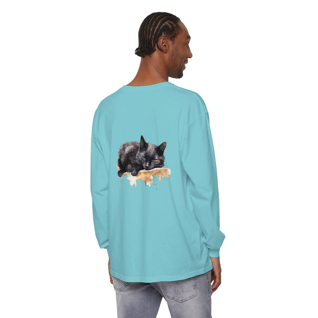 A watercolor illustration of a black cat peacefully sleeping on a t-shirt