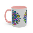 Colorful mandala mug featuring intricate floral art design on grey background