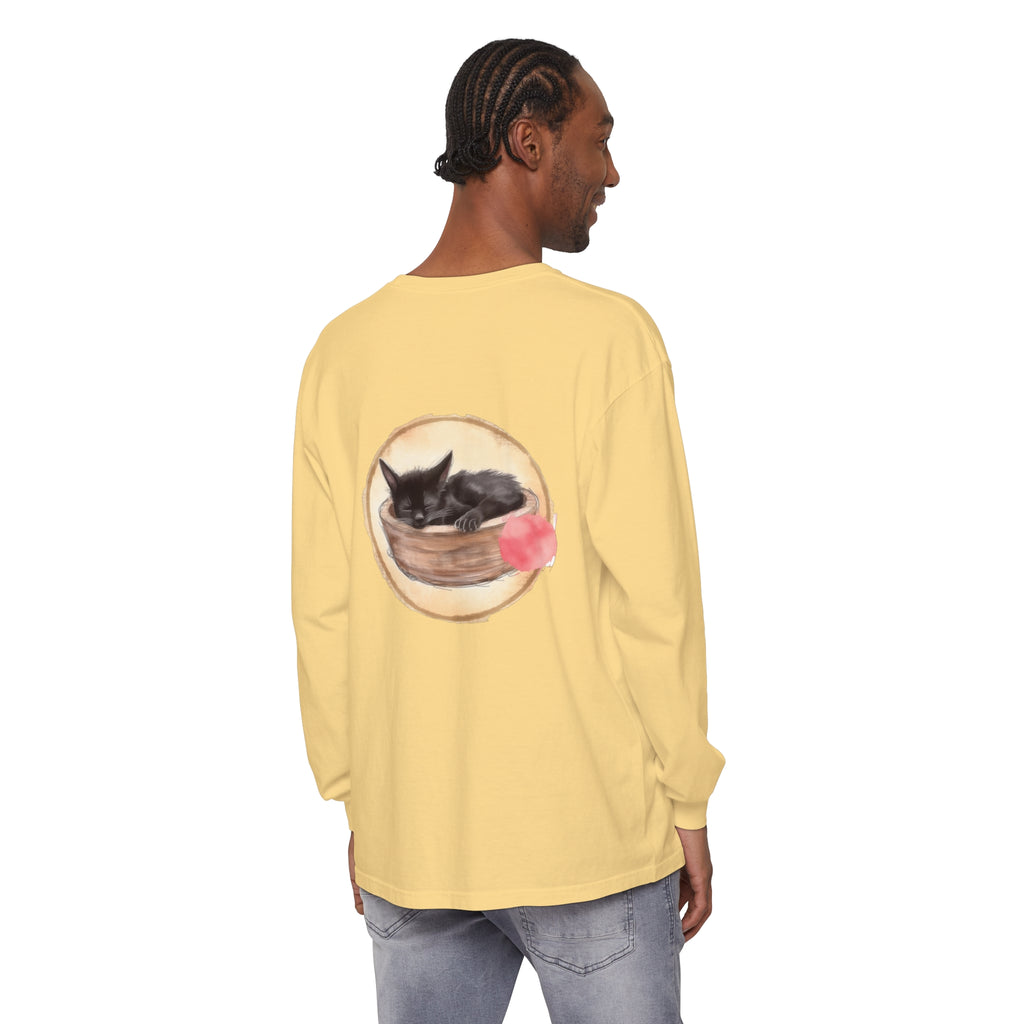 A watercolor illustration of a sleeping cat in a bowl on a long sleeve t-shirt