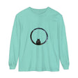 A close-up image of a black long sleeve t-shirt with a mysterious sphere design, suitable for both men and women