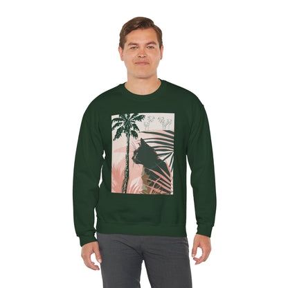 Black unisex heavy blend crewneck sweatshirt with a cute cat design under palm trees