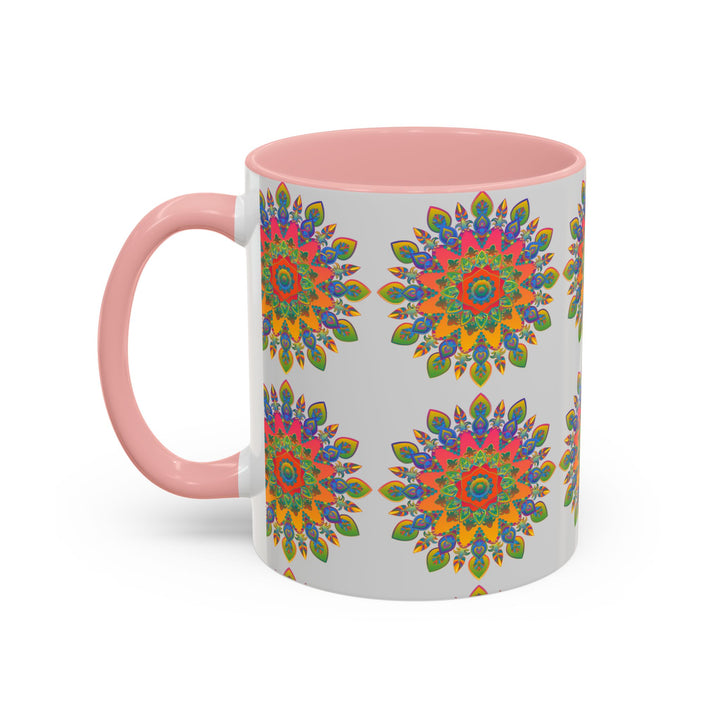 A beautifully painted mandala design in various vibrant colors on a grey ceramic mug