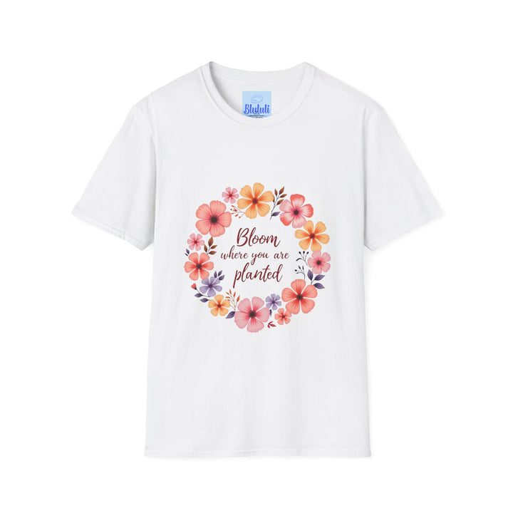 A white t-shirt with a colorful floral mandala design and a quote that says Be kind to yourself and others in bold typography