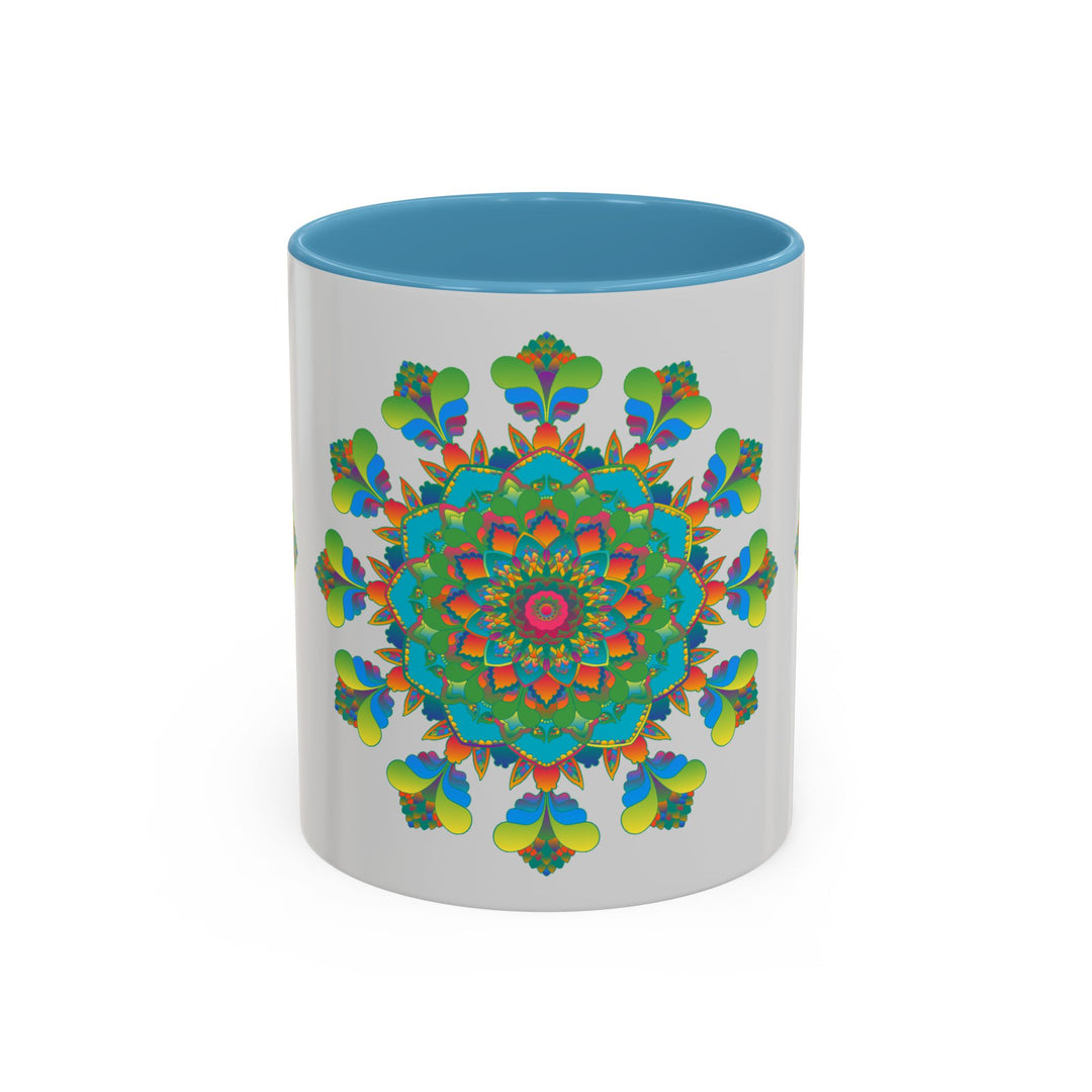 Colorful mandala art mug with vibrant red, blue, and yellow designs on a grey background