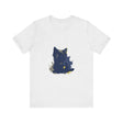 Close up of a midnight blue t-shirt with a mysterious cat silhouette design in the moonlight