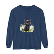 Adorable black kitten sitting in a colorful flower garden, printed on a long sleeve t-shirt