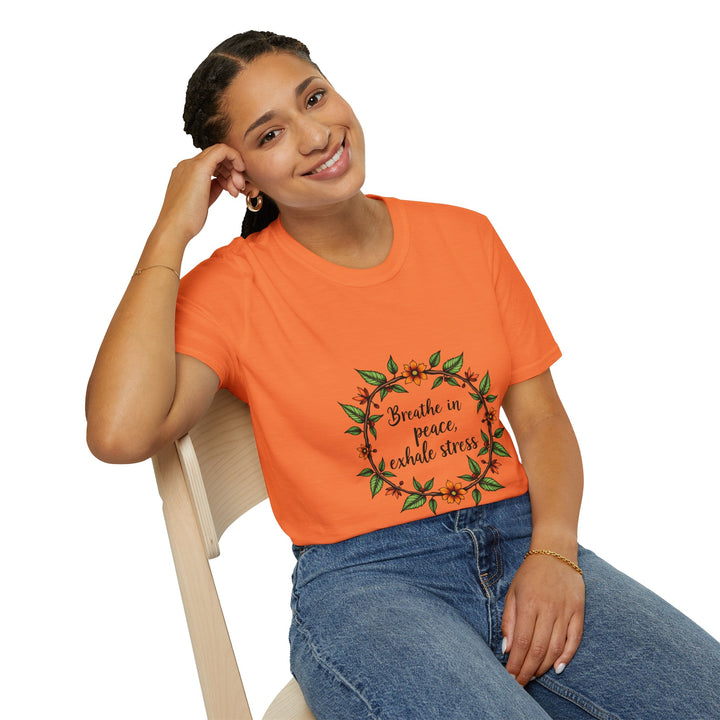 Close-up image of a white t-shirt with a floral garland design and the text 'Breathe in Peace Exhale Stress' in a calming font