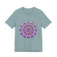 A close-up photo of a black t-shirt with an intricate floral mandala design