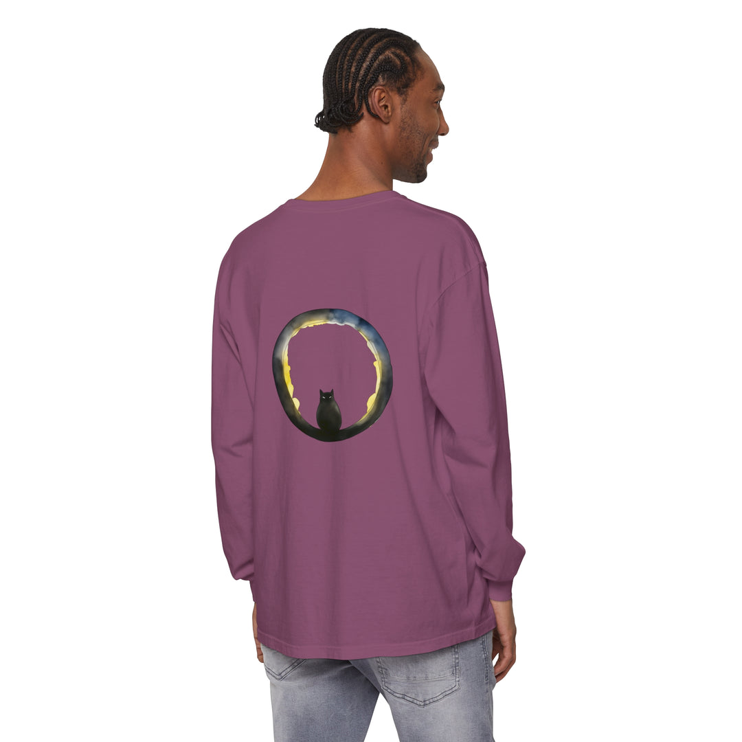 A black cat with glowing eyes sits in front of a crescent moon on a Halloween-themed t-shirt