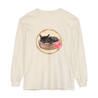 A watercolor illustration of a sleeping cat curled up inside a bowl on a long sleeve t-shirt