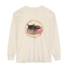 A watercolor illustration of a sleeping cat curled up inside a bowl on a long sleeve t-shirt
