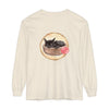 A watercolor illustration of a sleeping cat curled up inside a bowl on a long sleeve t-shirt