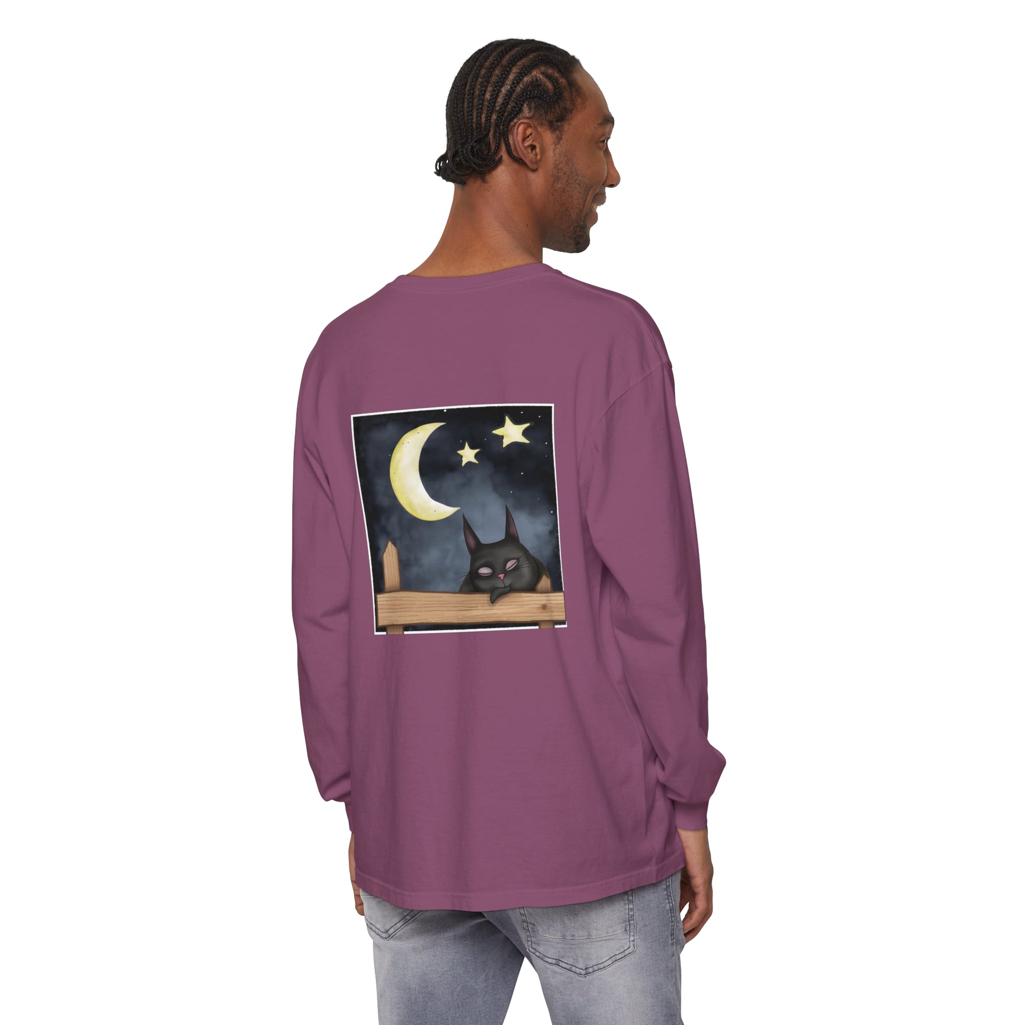 A black t-shirt with a sleeping cat silhouette against a starry night sky