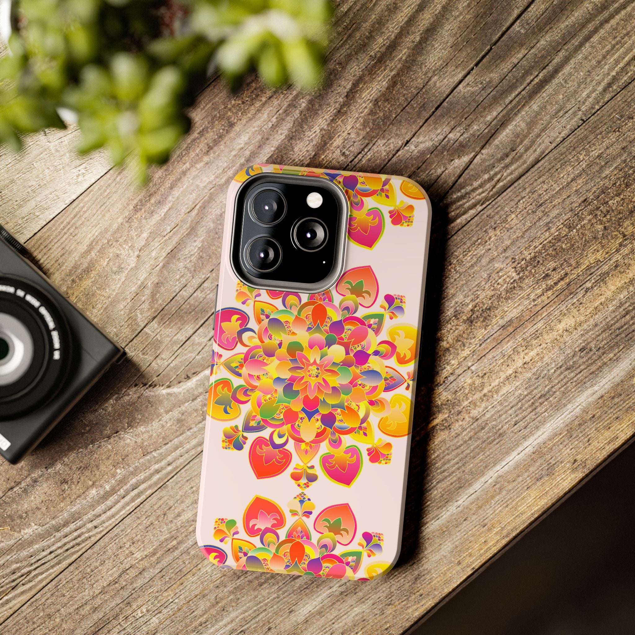 A close-up image of a hand drawn mandala art phone case with intricate and colorful designs