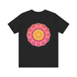 A vibrant and intricately designed mandala t-shirt in pink and yellow representing peace and harmony