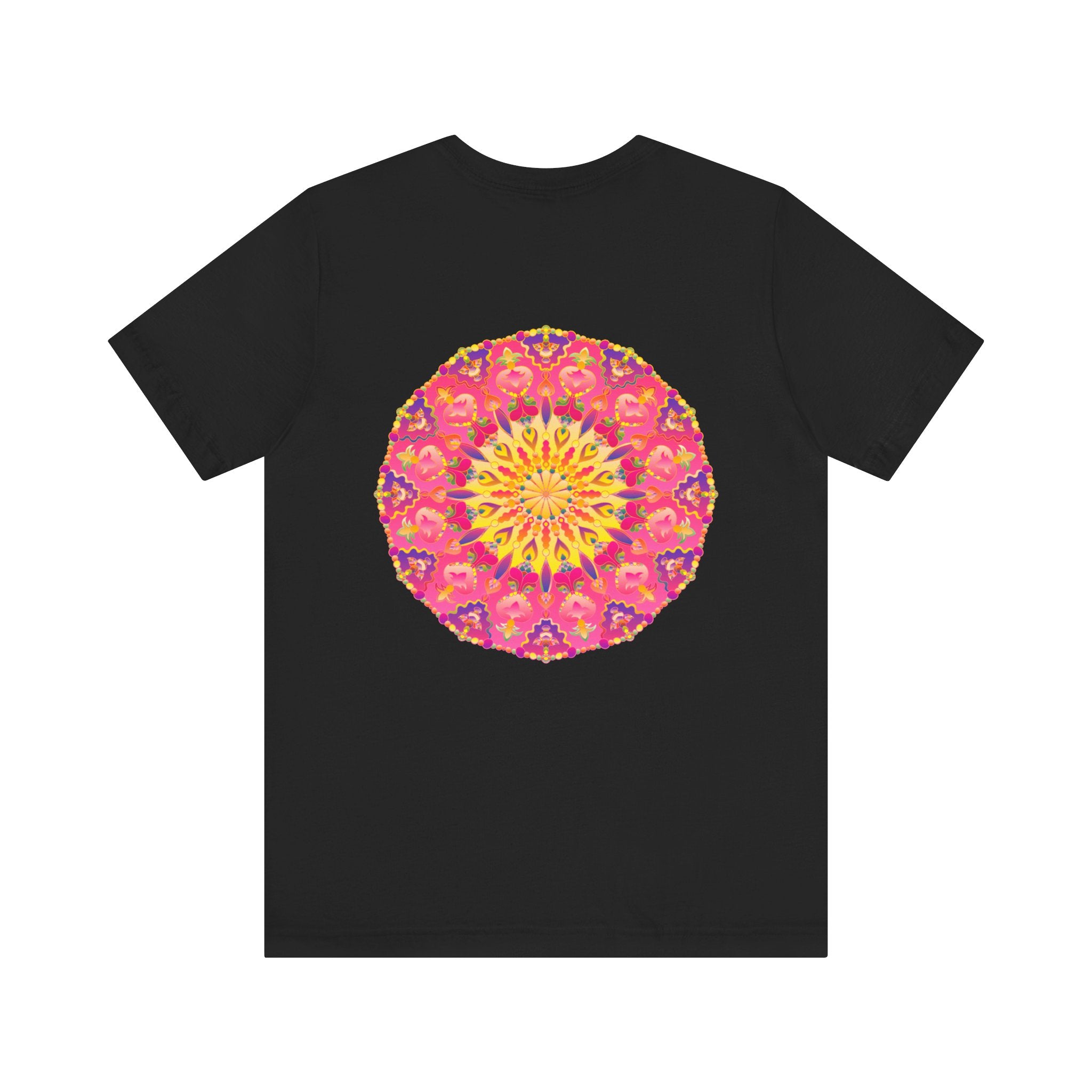 A vibrant and intricately designed mandala t-shirt in pink and yellow representing peace and harmony