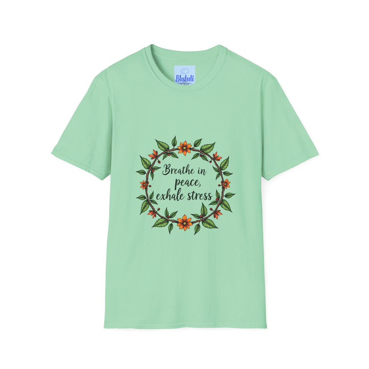 A close-up image of a white t-shirt with a colorful floral garland design and the text Breathe in Peace Exhale Stress printed on it