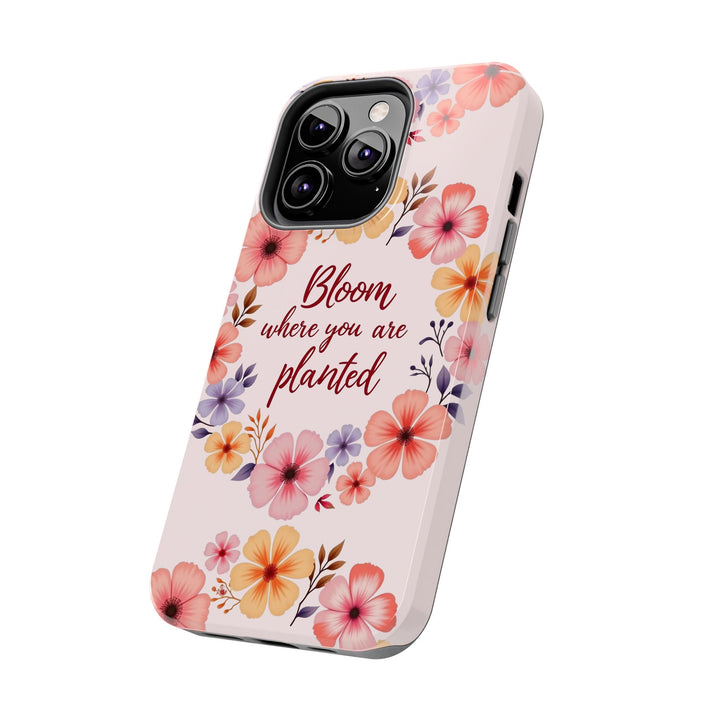 A light pink phone case featuring a beautiful flower garland design