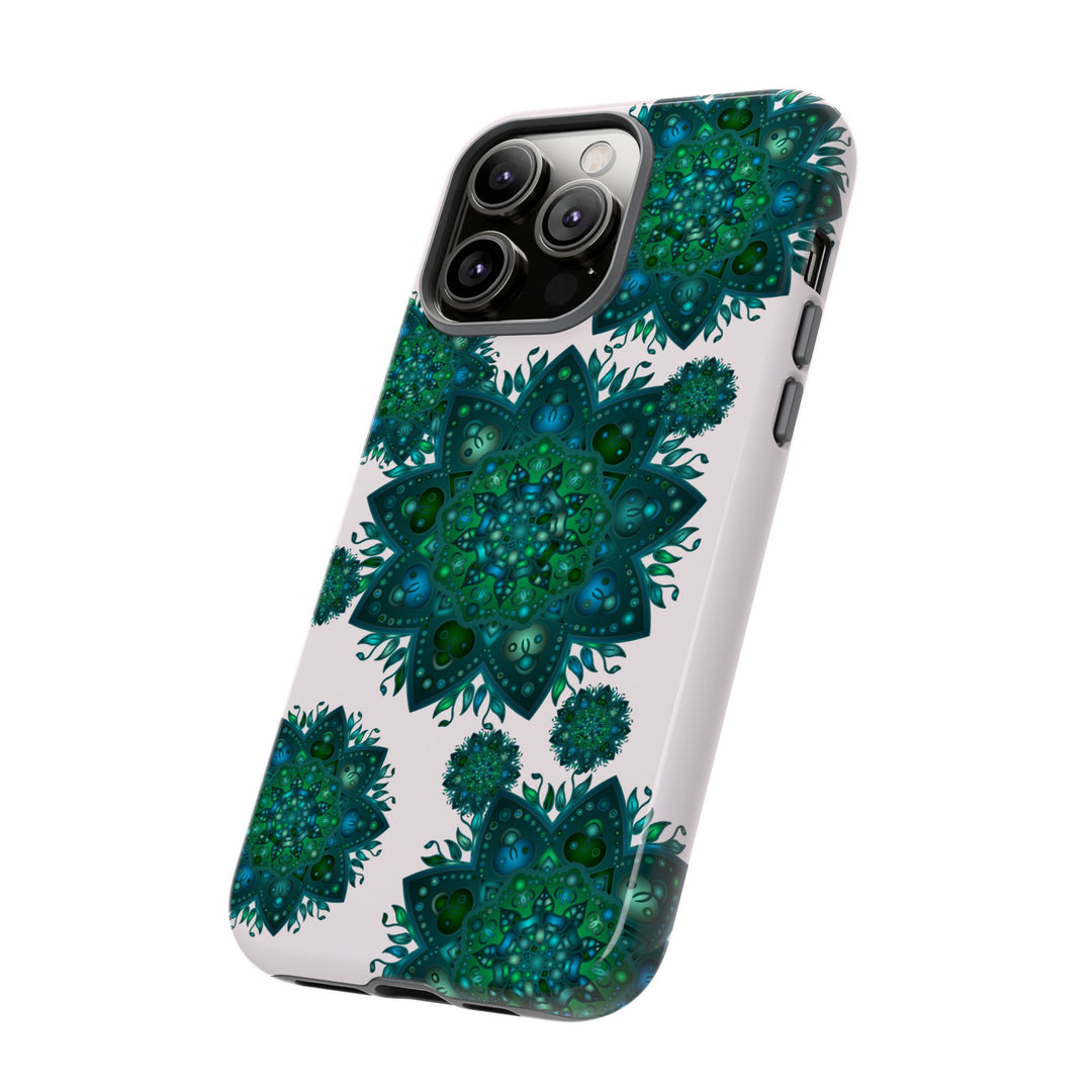 A beautiful light pink and green mandala phone case with a peaceful design