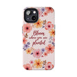 Light pink phone case with flower garland design that says 'Bloom where you are planted' on it