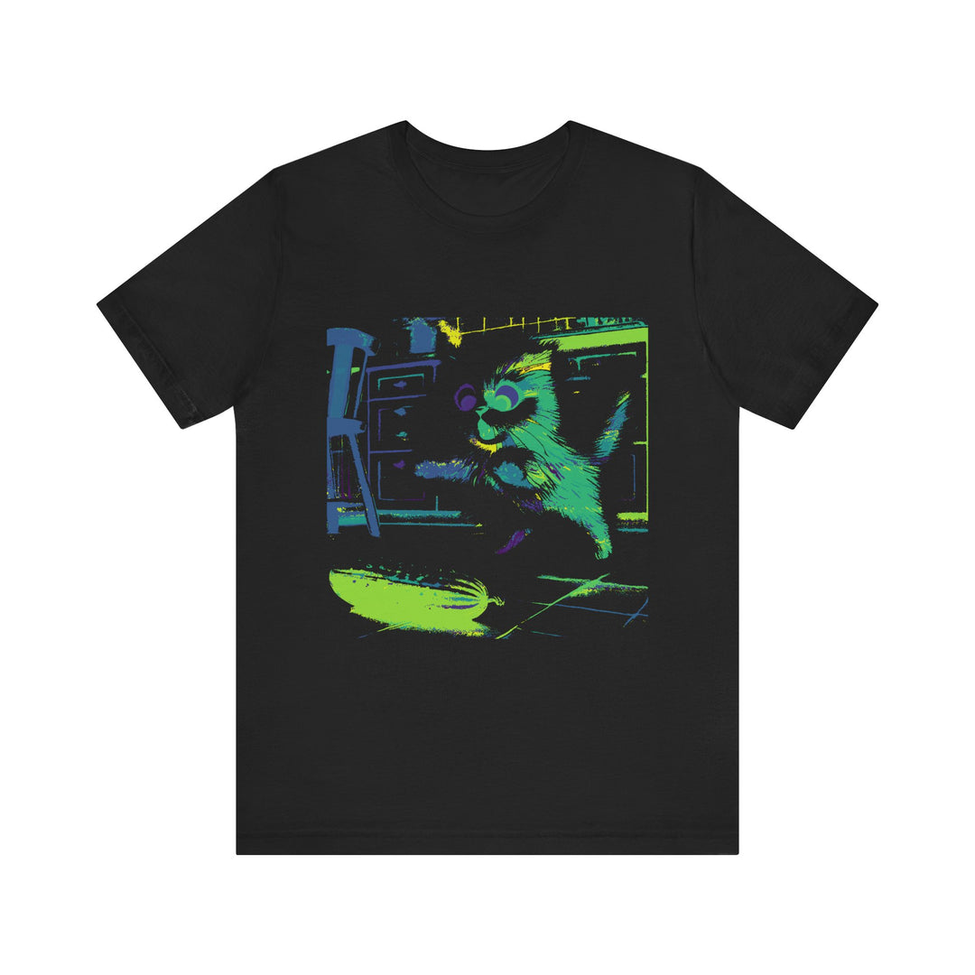 A black cat with a startled expression jumping away from a neon cucumber silhouette on a t-shirt