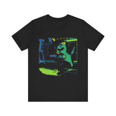 A black cat with a startled expression jumping away from a neon cucumber silhouette on a t-shirt