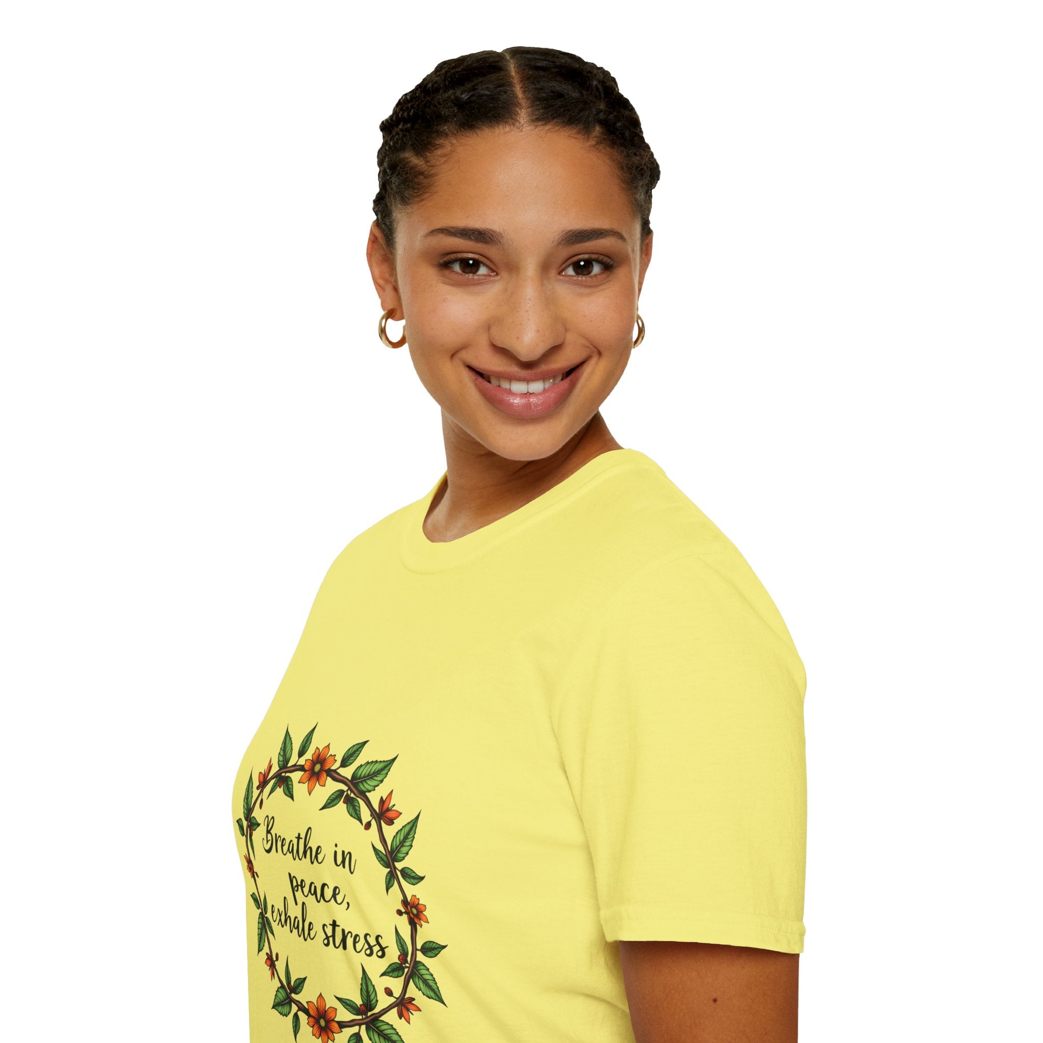 A close-up image of a soft, comfortable T-shirt featuring a floral garland design and the phrase Breathe in Peace Exhale Stress in elegant, cursive font