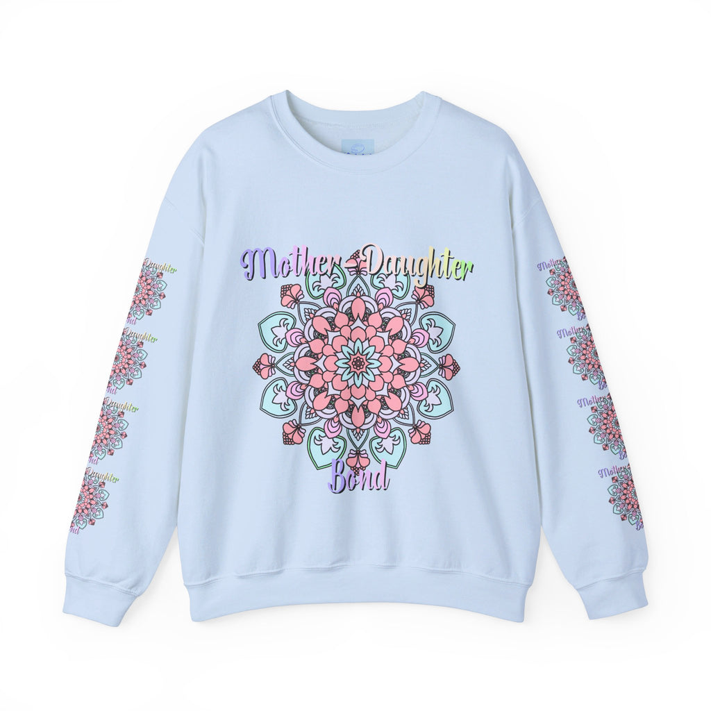 Mother and daughter sitting together, wearing matching 'Mother-Daughter Bond' Unisex Heavy Blend™ Crewneck Sweatshirts, the perfect birthday gift for Mom