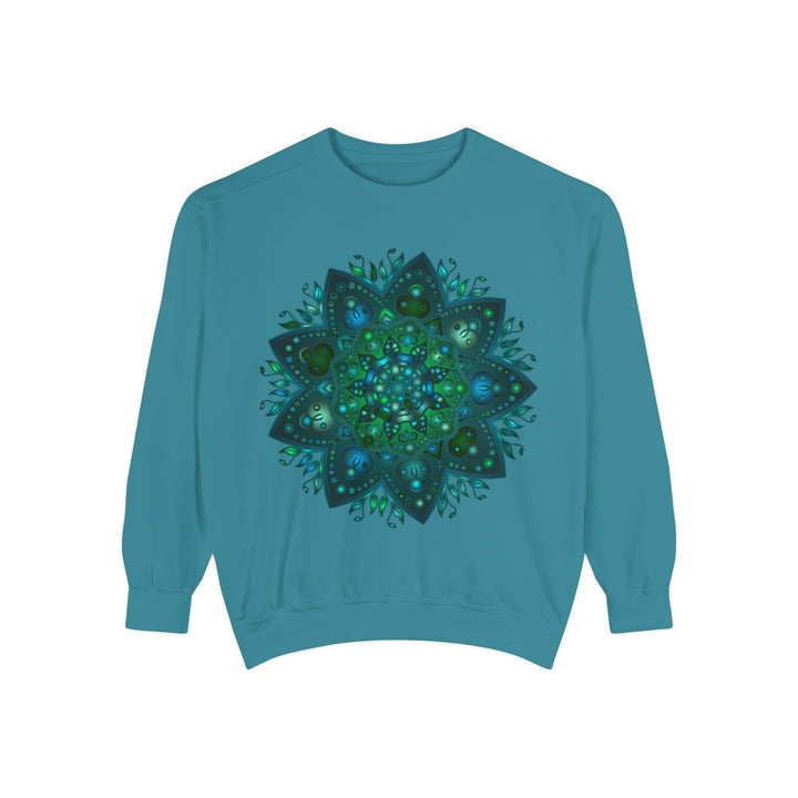 A close-up image of a teal and blue mandala sweatshirt featuring an intricate and detailed design, perfect for adding a pop of color to your wardrobe