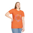 A close-up image of a white t-shirt with a colorful floral mandala design and a quote, perfect for bohemian and nature lovers